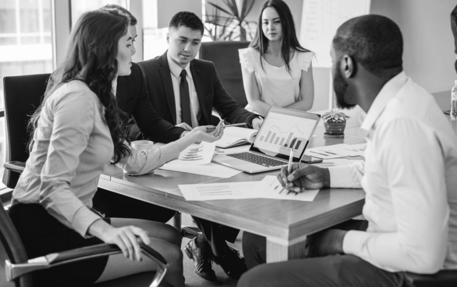 Collaborative workspace showing detailed financial planning and strategy development